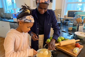 Paula and her daughter cooking together
